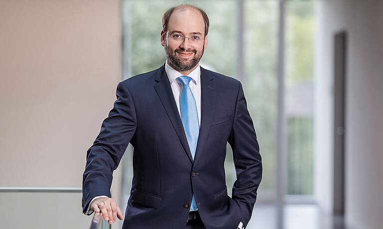 Headshot of Professor Michael Stich , a middle age man smiling.