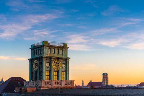 Thiersch Tower at sunset with the Frauenkirche and the Alps in the background 