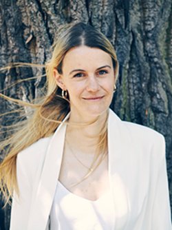 A woman with long hair smiling