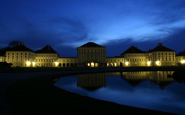 Illuminated Schloß Nymphenburg by night. 